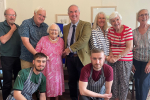 Geoffrey at the Drake Lodge with Residents and Staff